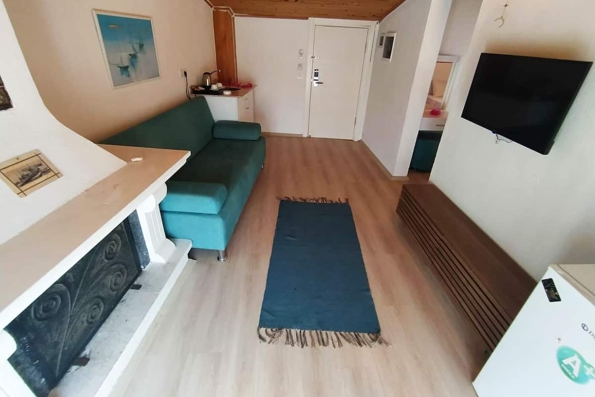 Deluxe Loft, 1 Bedroom, Fireplace, Sea View | 1 bedroom, minibar, desk, soundproofing