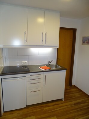 Fridge, coffee/tea maker, electric kettle, toaster