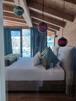 Deluxe Apartment, 2 Bedrooms, Balcony, Mountain View | Iron/ironing board, free WiFi, bed sheets