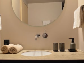 Shower, hair dryer, towels, toilet paper