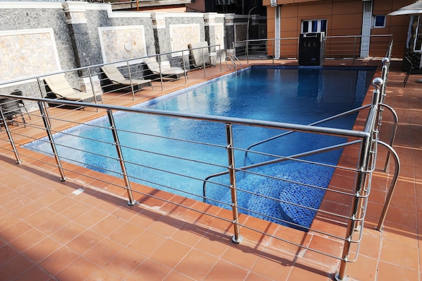 Indoor pool, outdoor pool, pool umbrellas, pool loungers