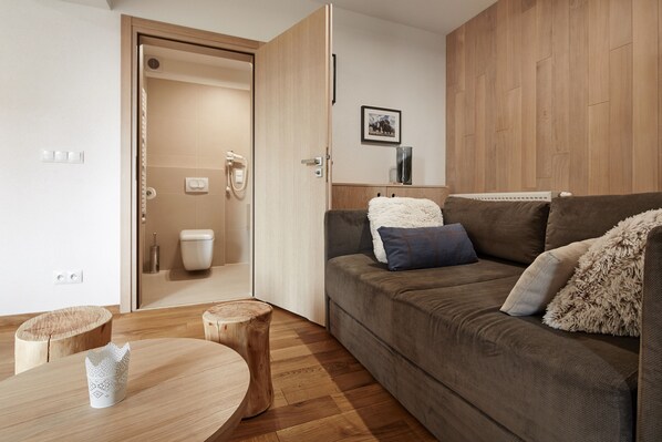Deluxe Apartment, 1 Bedroom | Living area | Flat-screen TV