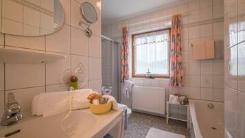 Shower, hair dryer, towels, toilet paper