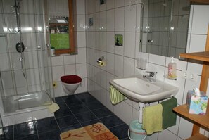Shower, towels, soap, toilet paper