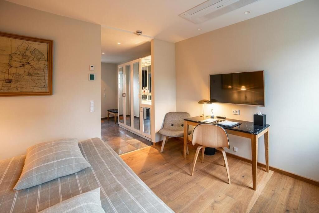 large estate room with bathtub | in-room safe, individually decorated, desk, blackout curtains