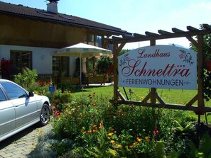 A sign for 'Landhaus Schnettra' indicating it's a bed and breakfast.
