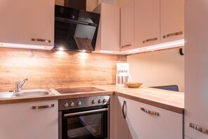 Fridge, oven, dishwasher, high chair