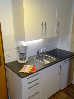 Fridge, coffee/tea maker, electric kettle, toaster