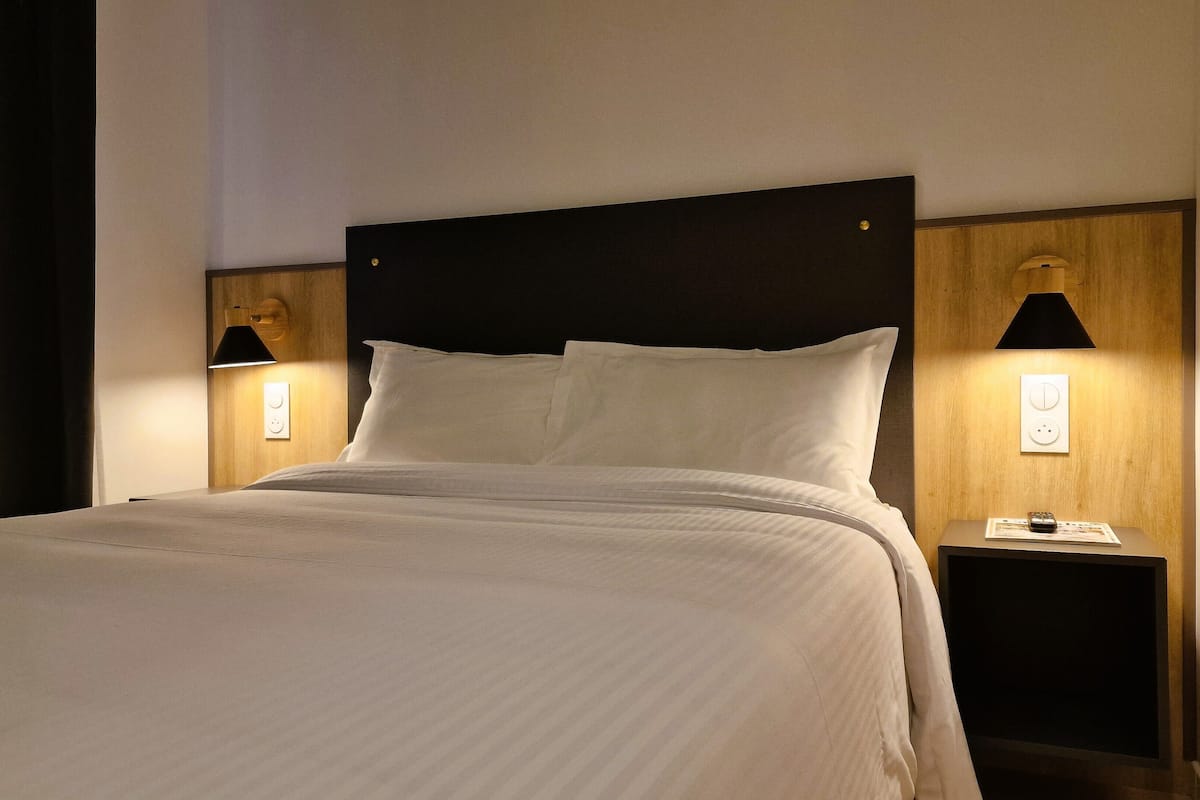 double room | premium bedding, desk, laptop workspace, blackout curtains