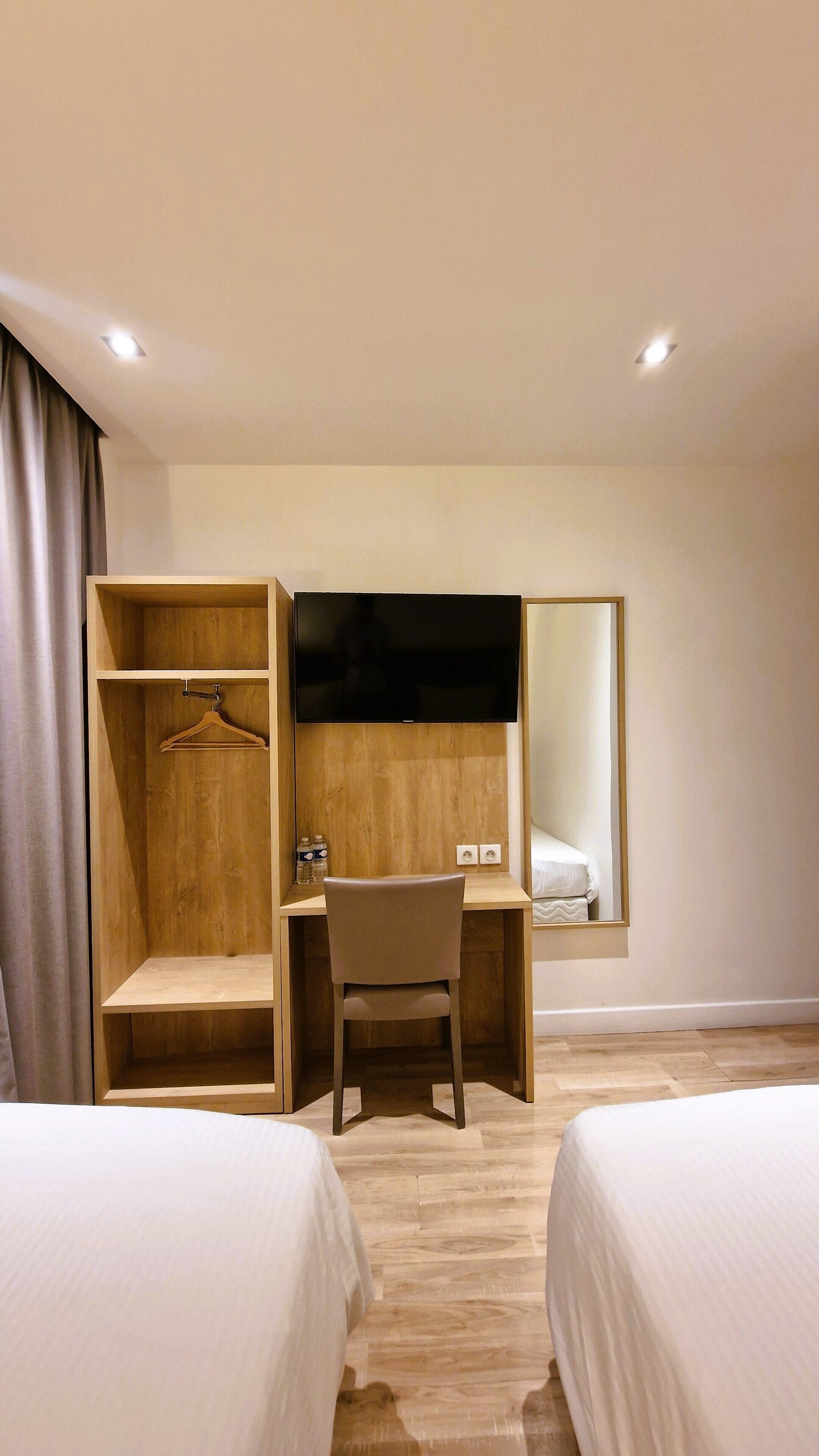 twin room | premium bedding, desk, laptop workspace, blackout curtains