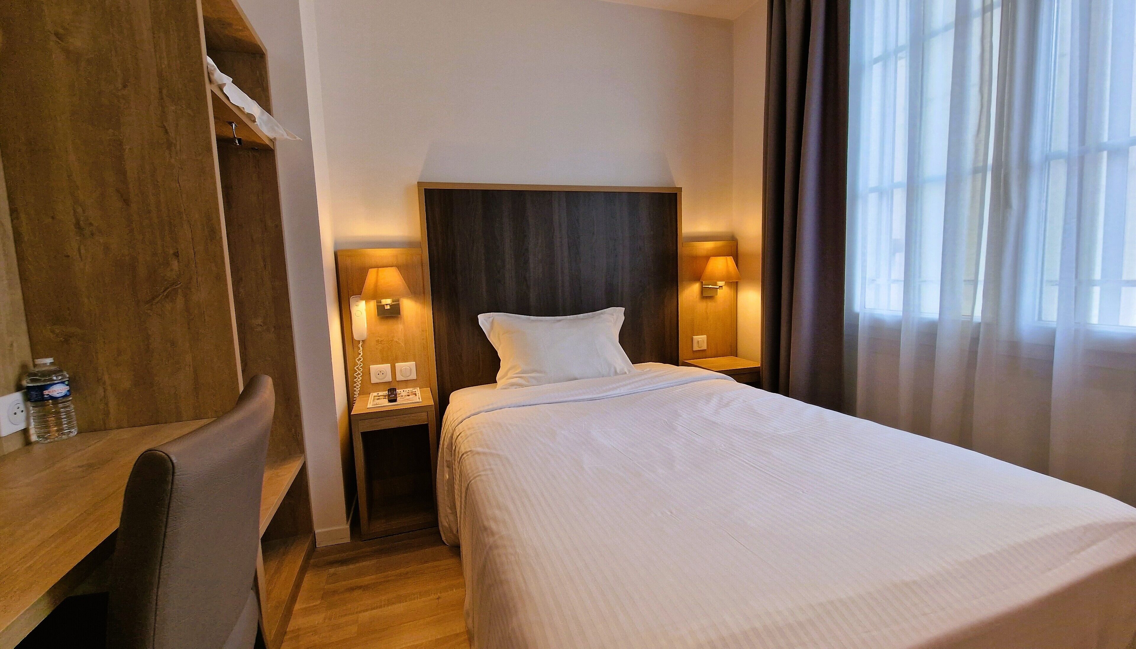 single room | premium bedding, desk, laptop workspace, blackout curtains