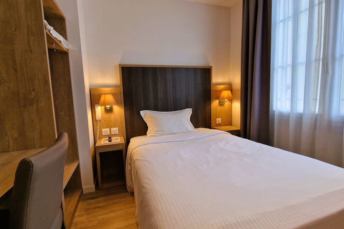 single room | premium bedding, desk, laptop workspace, blackout curtains