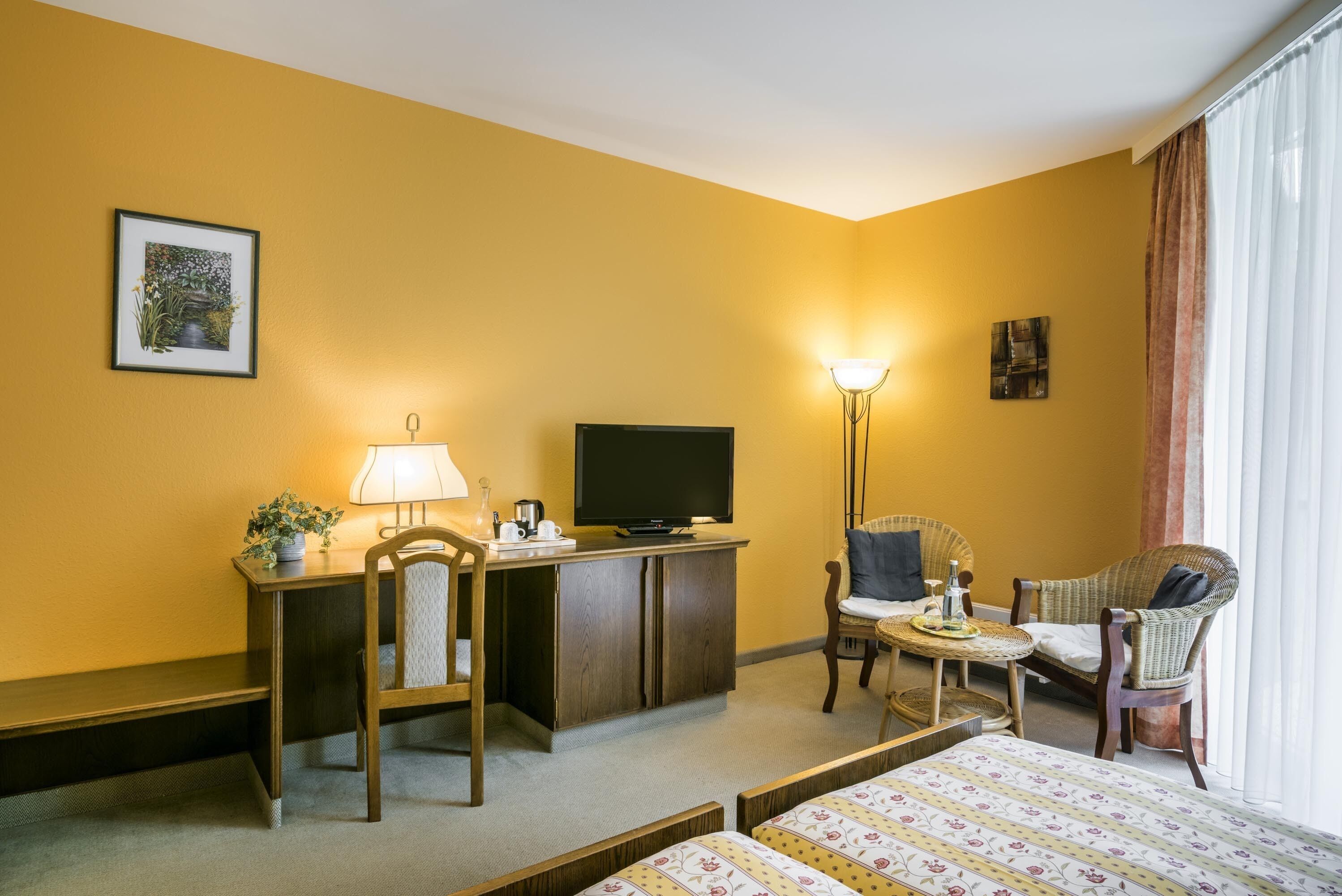 comfort double room | living area | flat-screen tv