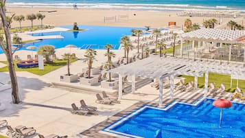 On the beach, sun-loungers, beach umbrellas, beach towels