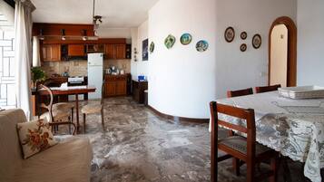 Apartment, 3 Bedrooms | Living area | Flat-screen TV