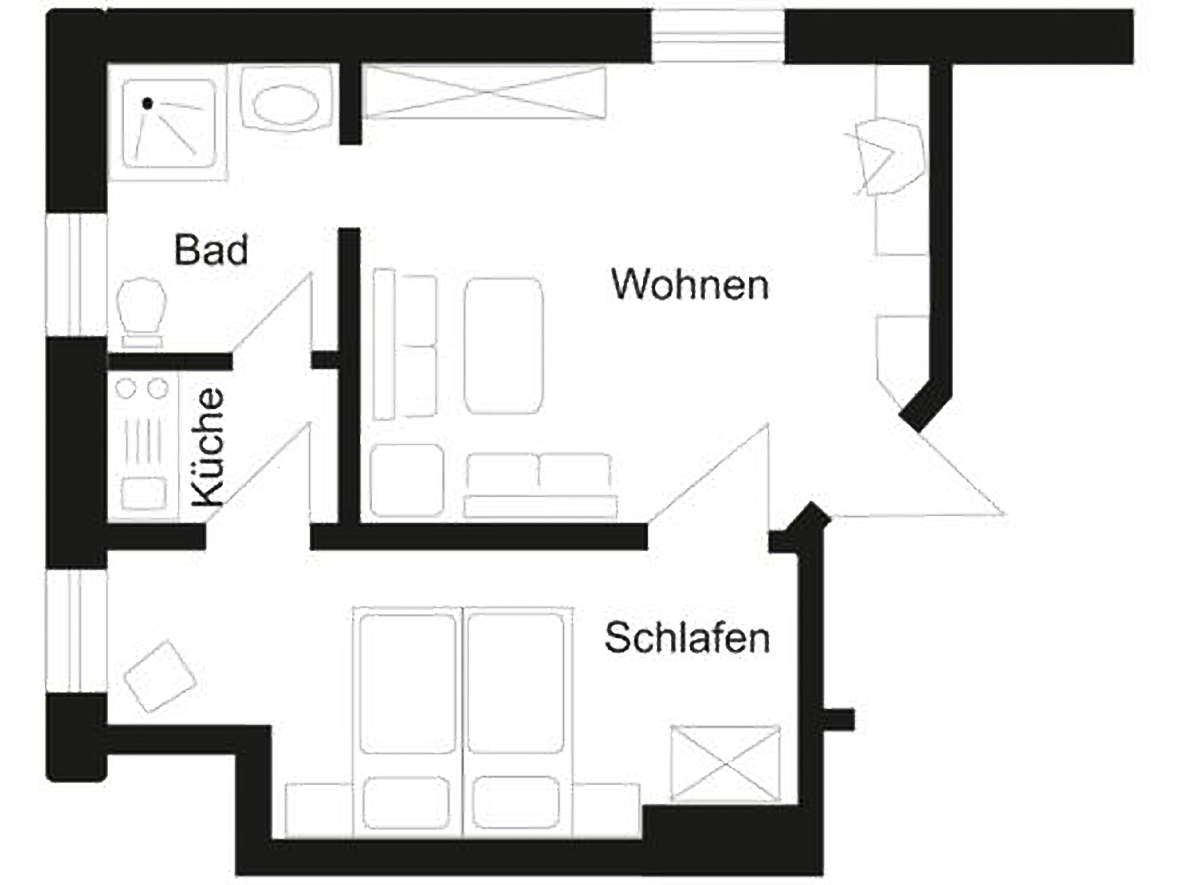 A floor plan of a hotel with labeled rooms: Bad, Küche, Wohnen, and Schlafen.