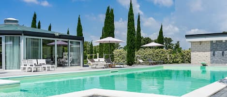 Seasonal outdoor pool, pool umbrellas, pool loungers