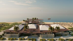 A resort with a beach view, palm trees, and a boat on the water. - Thalasses Villas Rethymno (Rethymno)