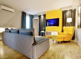 Deluxe Suite, 1 Queen Bed with Sofa bed, Kitchen | Living area | Flat-screen TV