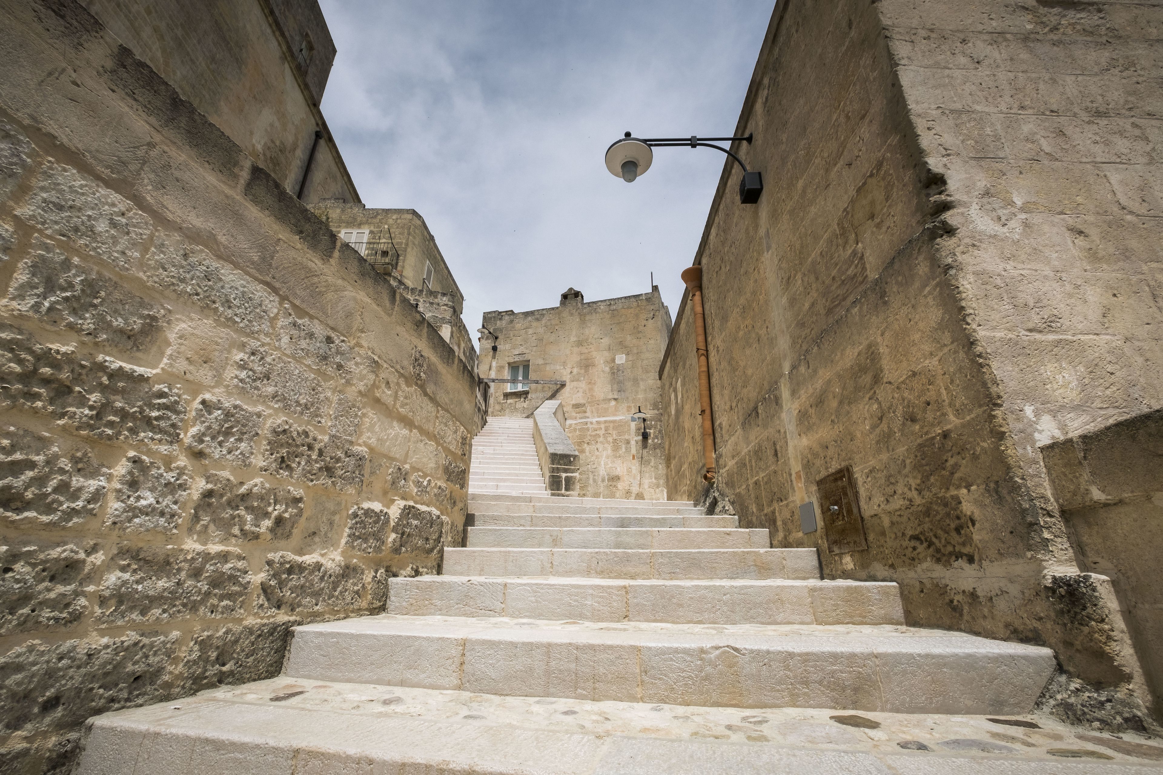 A narrow stone staircase in a historic building.