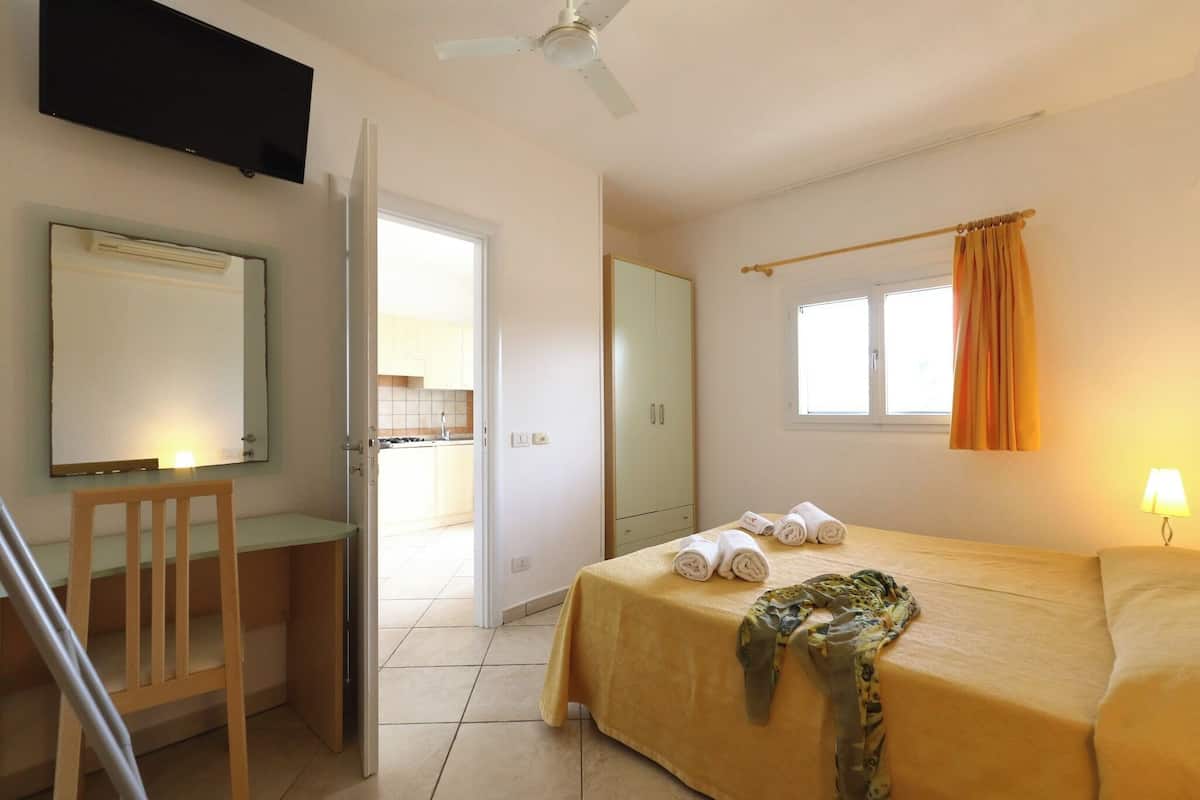 Family Apartment, 1 Bedroom | In-room safe, desk, iron/ironing board, cots/infant beds