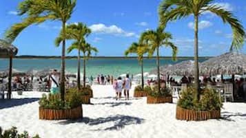 Beach nearby, white sand, beach towels