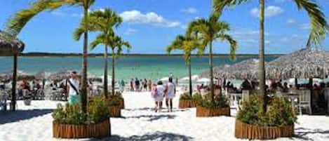 Beach nearby, white sand, beach towels