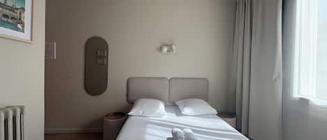 Desk, blackout curtains, free WiFi, bed sheets