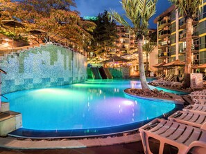 A swimming pool with a slide, lounge chairs, and a building labeled "MIMOS A" in the background. - Mimosa Sunshine Hotel COOEE - All Inclusive (Golden Sands)