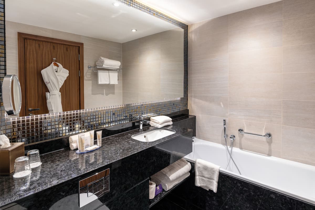 designer toiletries, hair dryer, towels, soap