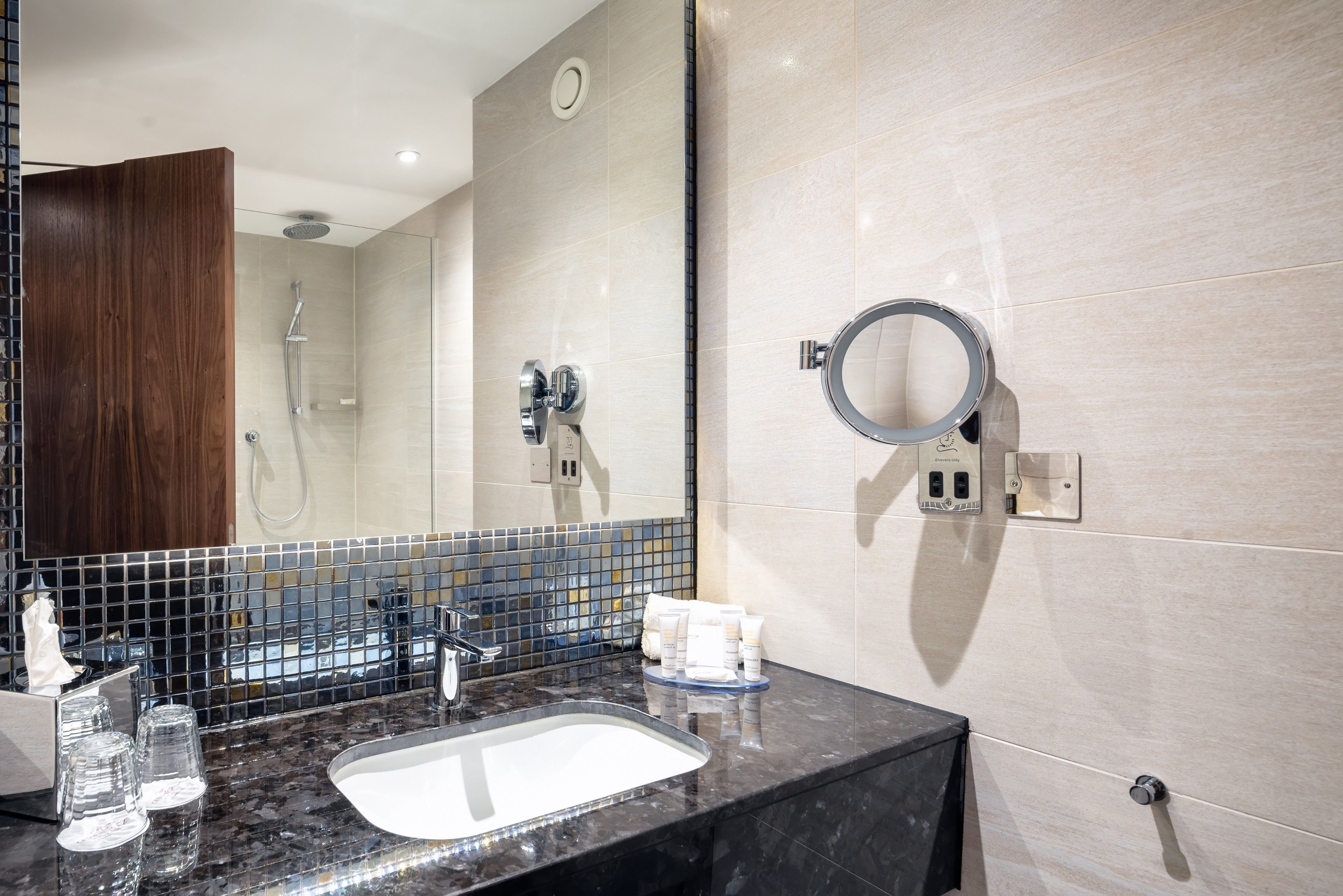 designer toiletries, hair dryer, towels, soap