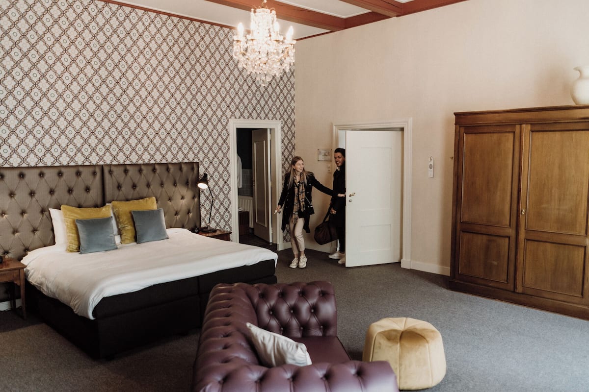 deluxe suite | premium bedding, in-room safe, desk, laptop workspace