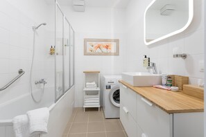 Combined shower/tub, hair dryer, towels, soap