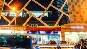A high-rise building with multiple floors, a prominent 'West Innsula' sign, and a 'Units for Sale' sign below. - West Insula Units By AYS (Quezon City)