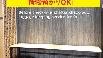 A hotel room with a luggage storage area and a check-in counter.