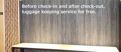 A hotel room with a luggage storage area and a check-in counter.
