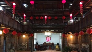 A traditional wooden building with a central courtyard. - Nanjing Tulou Qingdelou Inn (Zhangzhou)