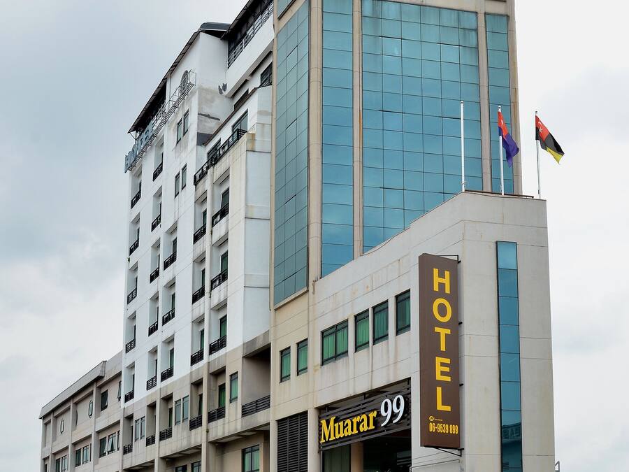 A hotel with a modern facade, multiple floors, and a prominent 'HOTEL' sign.