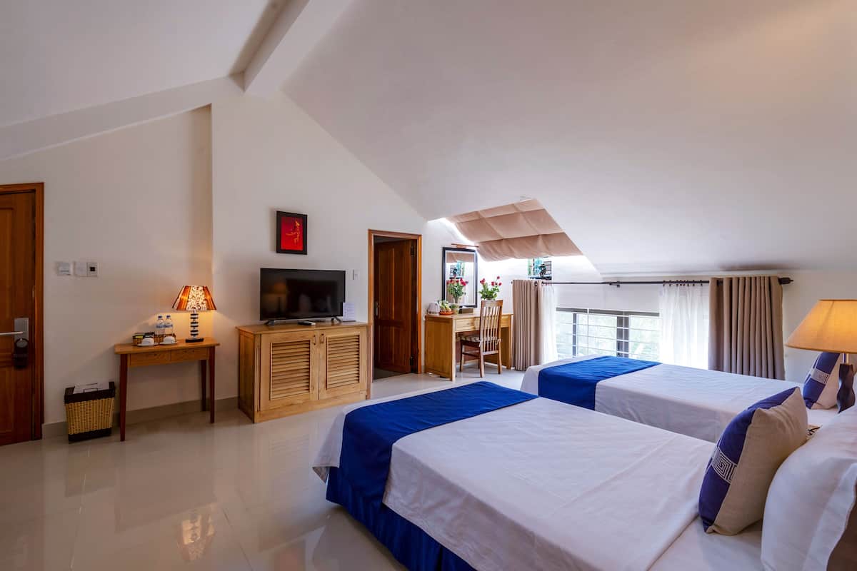 Family Room, 2 Bedrooms | Minibar, in-room safe, desk, laptop workspace