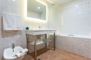 Shower, deep soaking tub, free toiletries, hair dryer