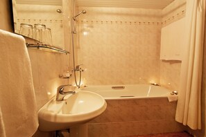 Shower, deep-soaking bathtub, free toiletries, hair dryer