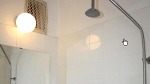 A bathroom with a sink, mirror, and shower. - Sunny Varshava Hotel (Golden Sands)