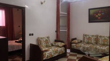 Apartment, 2 Bedrooms | Living room | Flat-screen TV