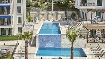 2 outdoor pools, pool umbrellas, pool loungers