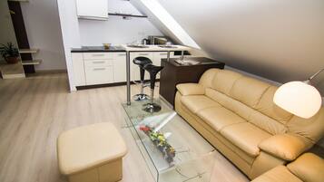 Deluxe Apartment, 2 Bedrooms, Kitchen | Living area | Flat-screen TV