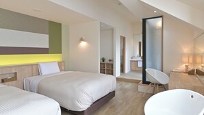 A modern bedroom with two beds, a large mirror, a bathtub, and a small bathroom. - Kawaguchiko Park Hotel (Fujikawaguchiko)