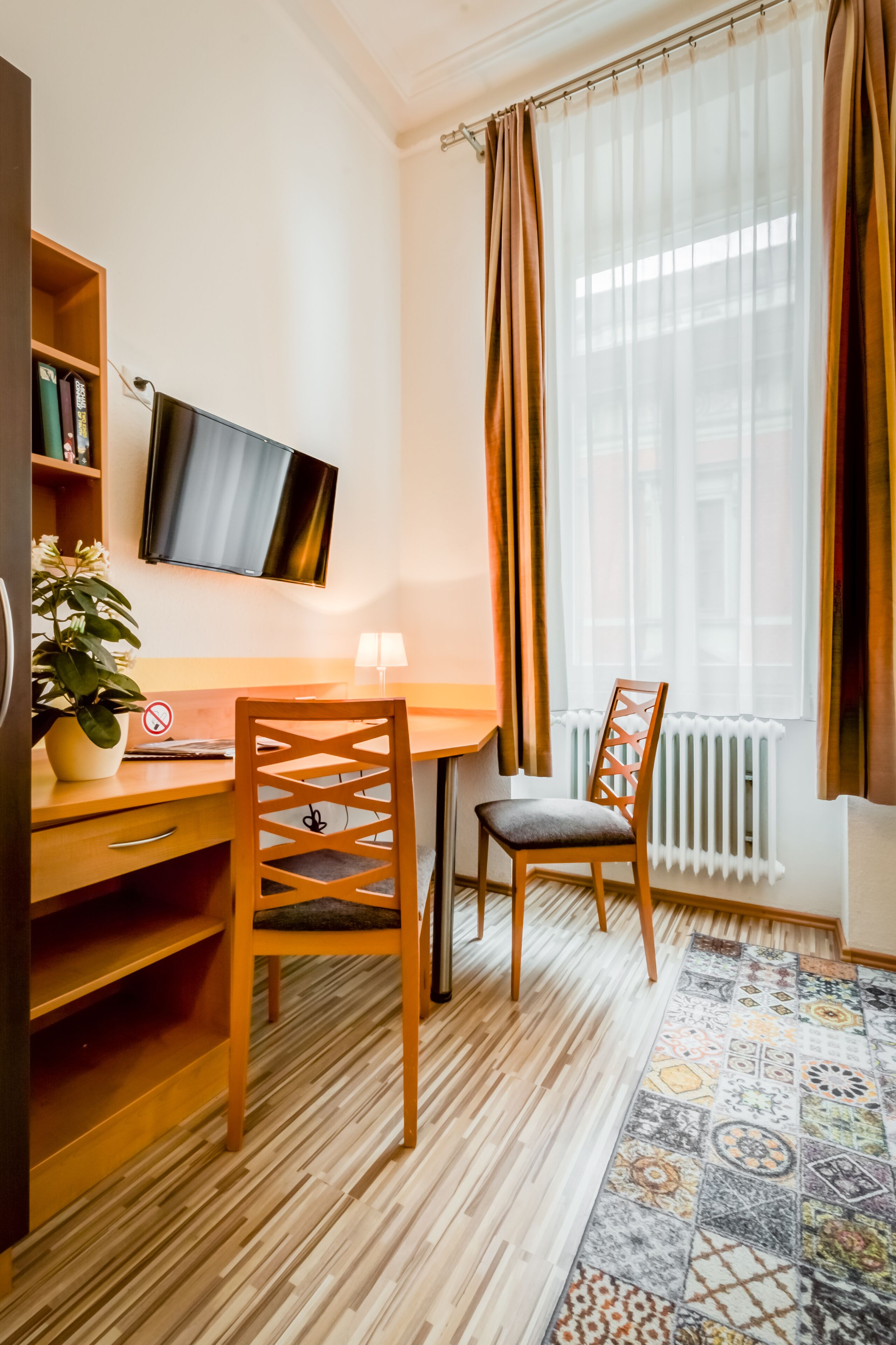 comfort double or twin room | living area | flat-screen tv