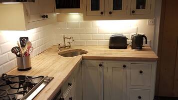 Cottage, 2 Bedrooms | Private kitchen | Full-sized fridge, microwave, oven, stovetop