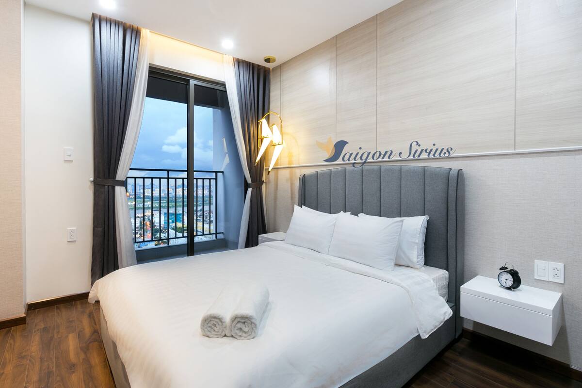 Deluxe Apartment, 2 Bedrooms, River View | Desk, laptop workspace, blackout drapes, iron/ironing board