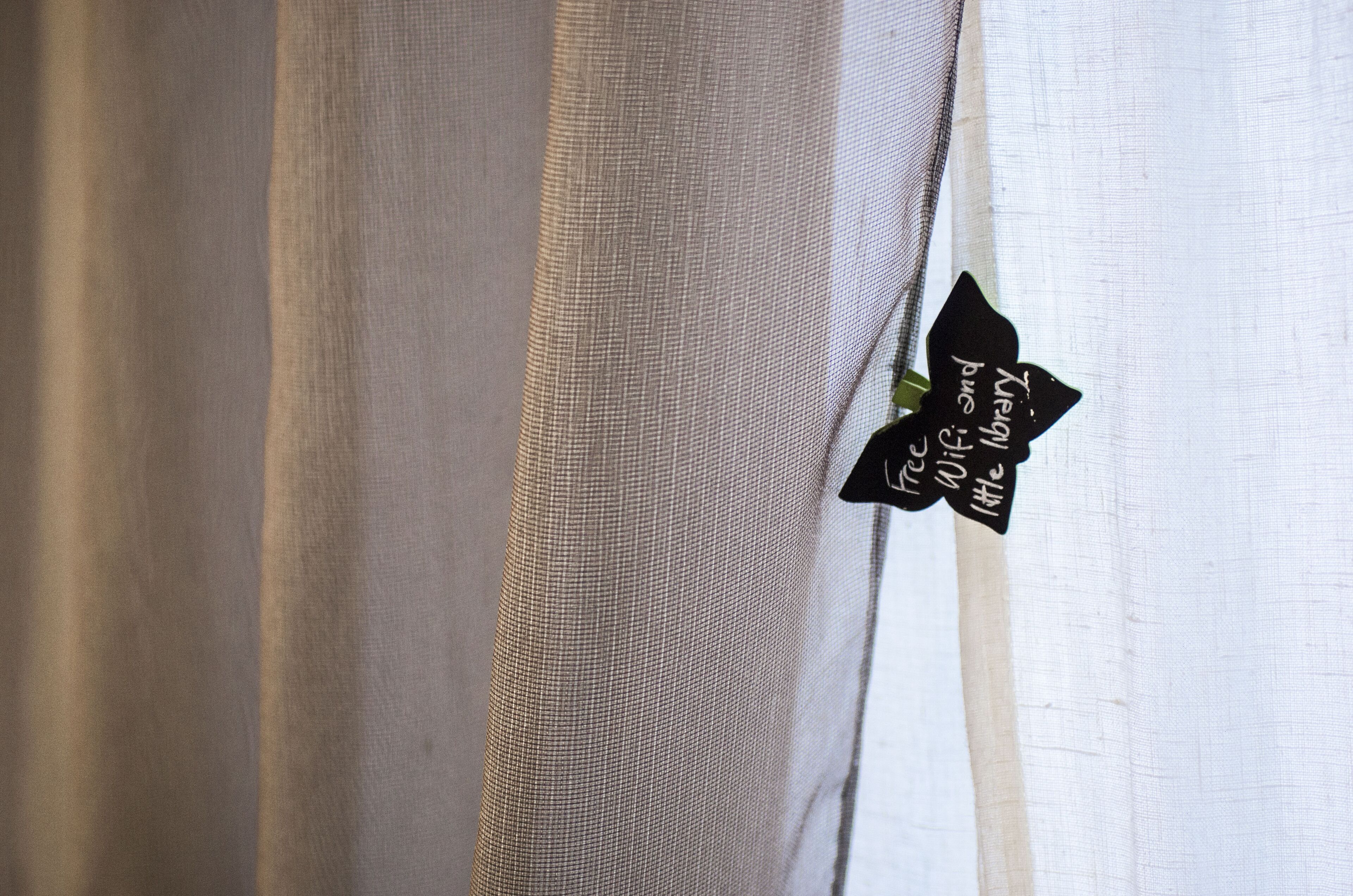 A close-up of a fabric with a tag attached.